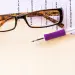 Glasses and pen on salary survey
