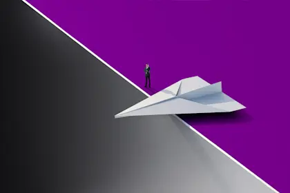 businessman standing near paper airplane
