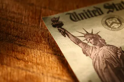 Closeup of statue of liberty on printed United States saving bond