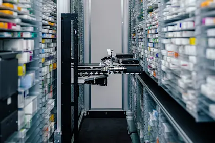 Medicine in shelves in commissioning machine in pharmacy