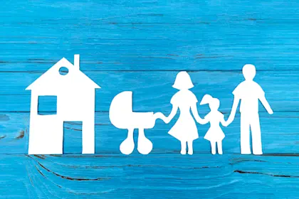 Paper silhouette of family with baby carriage 