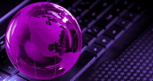 virtual purple globe over backlit keyboard