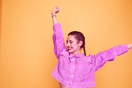 Colourful studio portrait of a young woman