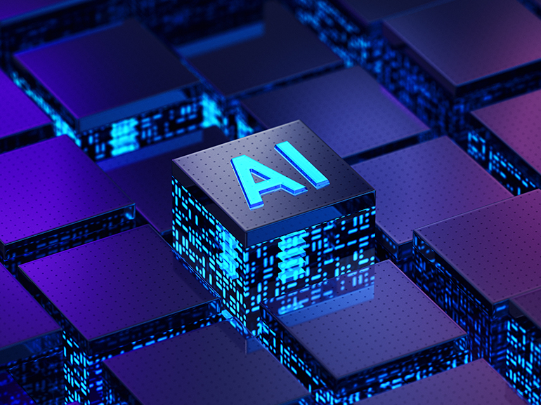 An image of a semiconductor microchip on which the word AI is written. 