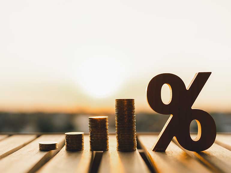 Stacked coins and percentage symbol