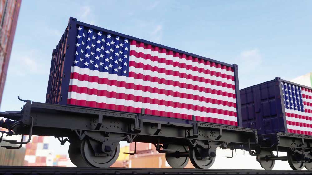 Containers with the US flag on them transported via train