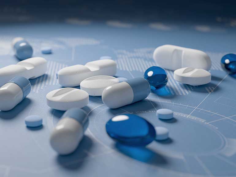 Different pills on a blue background