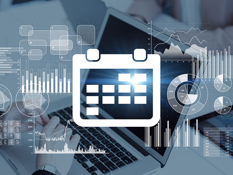 Virtual calendar, charts and graphs with a laptop in the background