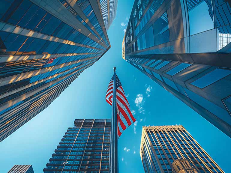 American flag between skyscrapers