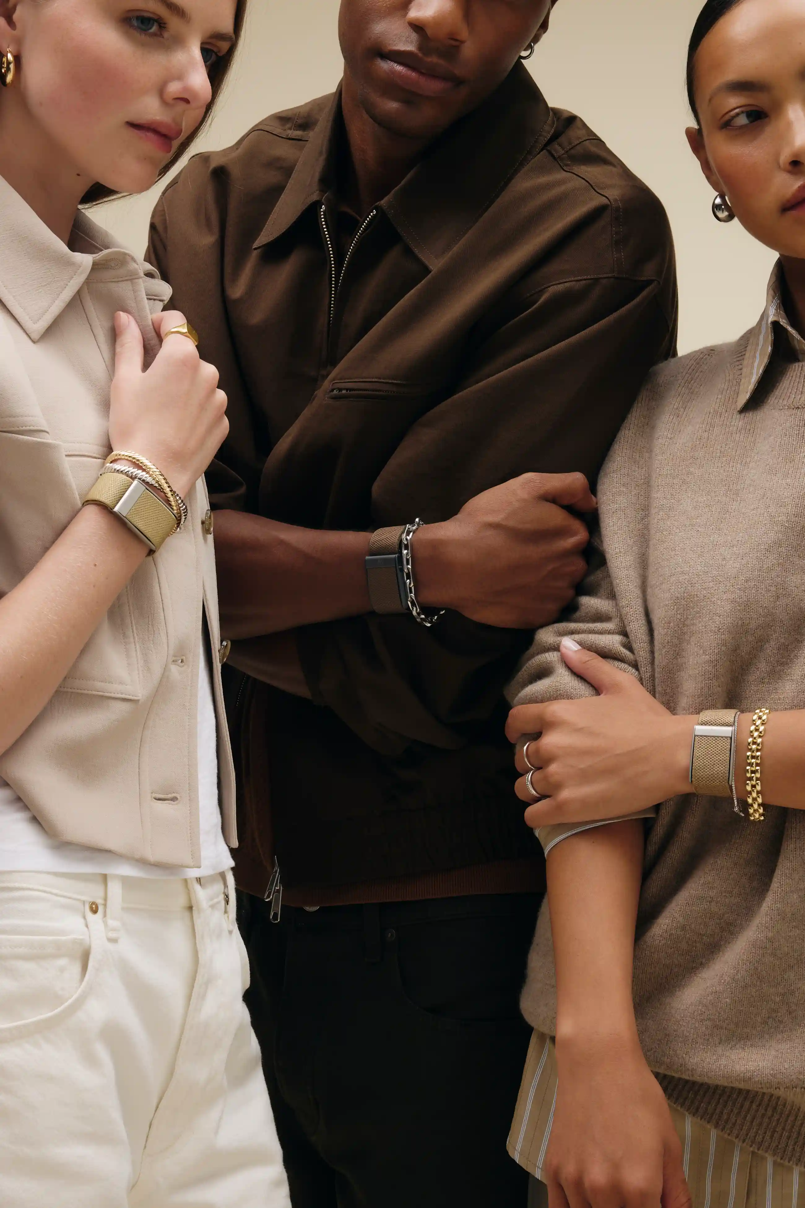 Three people wearing WHOOP in different band styles and colorways. Background image for the "The most customizable wearable" showcase tile on the AL Standalone homepage variant.