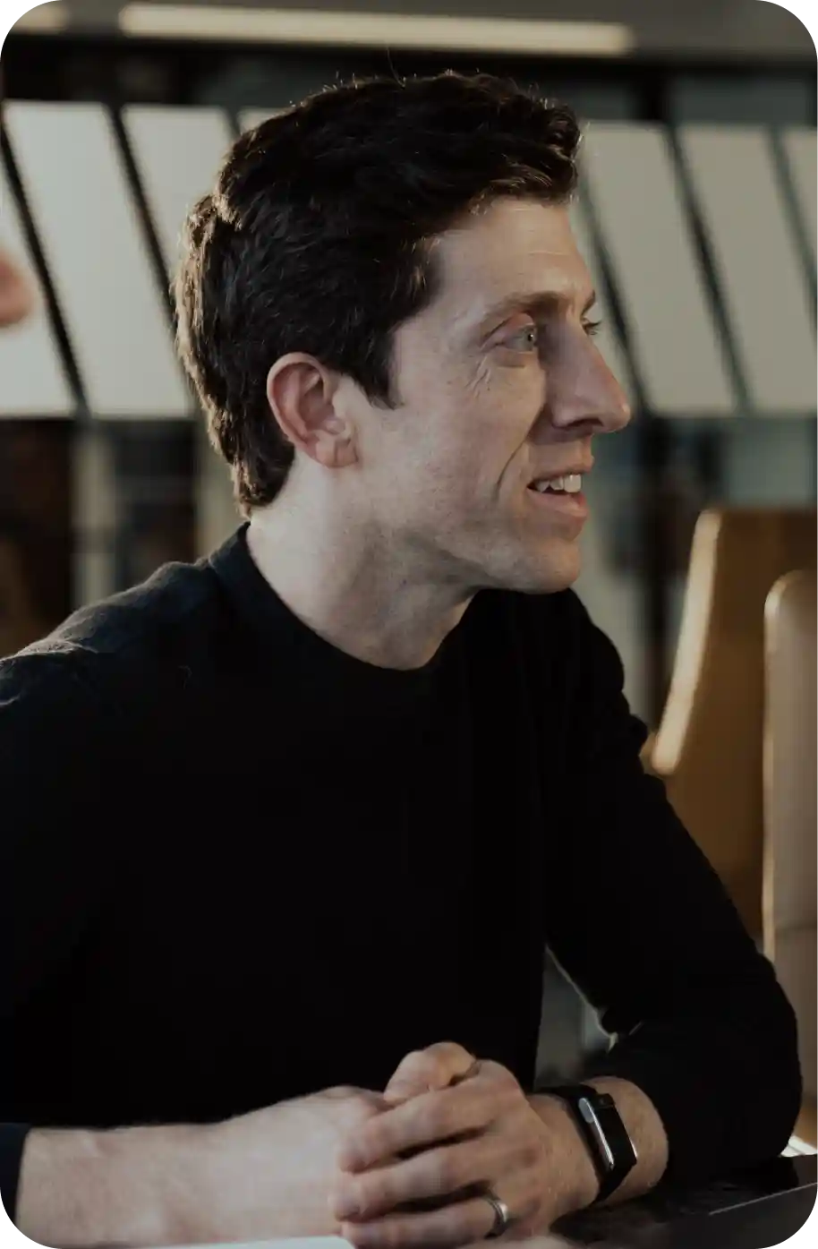 Sam, WHOOP team member, discussing performance and recovery data during a meeting, highlighting WHOOP’s data-driven approach to wearable health technology and optimization.