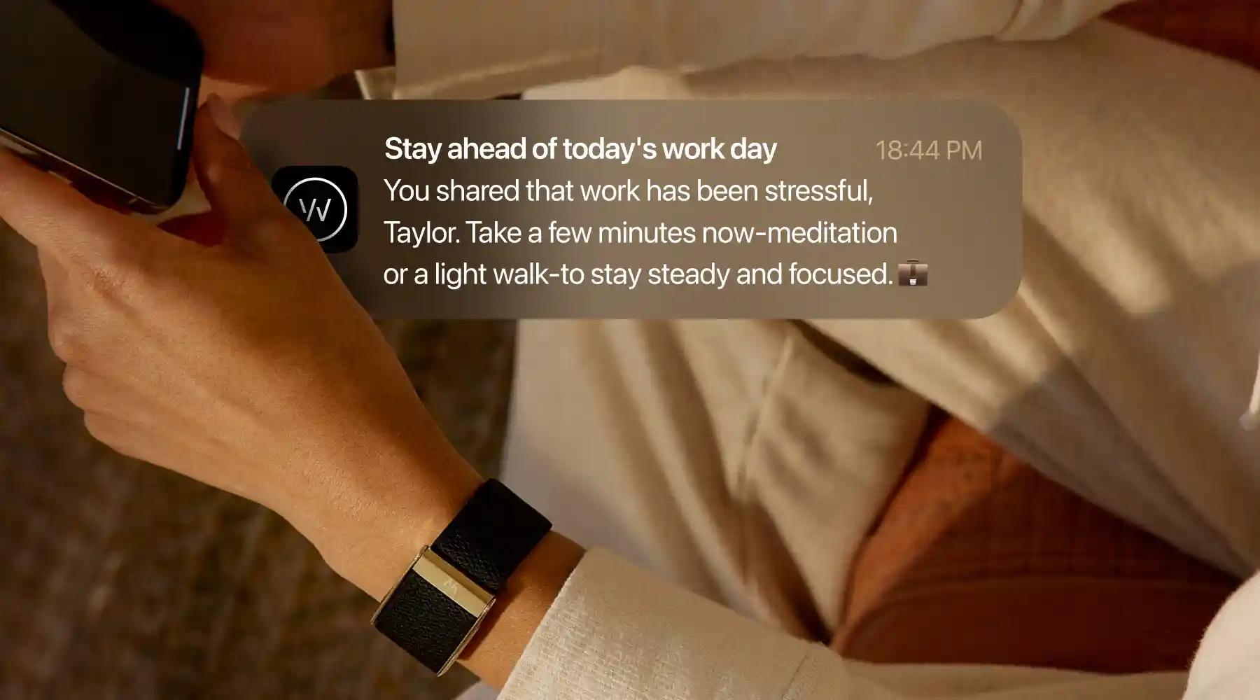 A push notification offering work-related stress coaching, suggesting meditation or a light walk.
