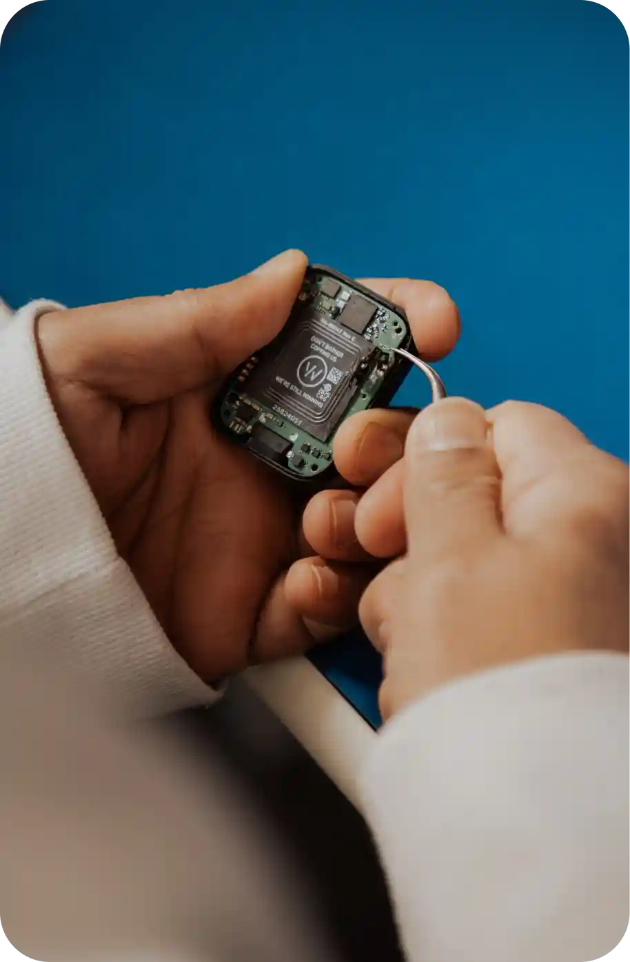 Close-up of a WHOOP wearable with exposed internal components, highlighting the device’s hardware engineering, sensor technology, and performance-focused design.