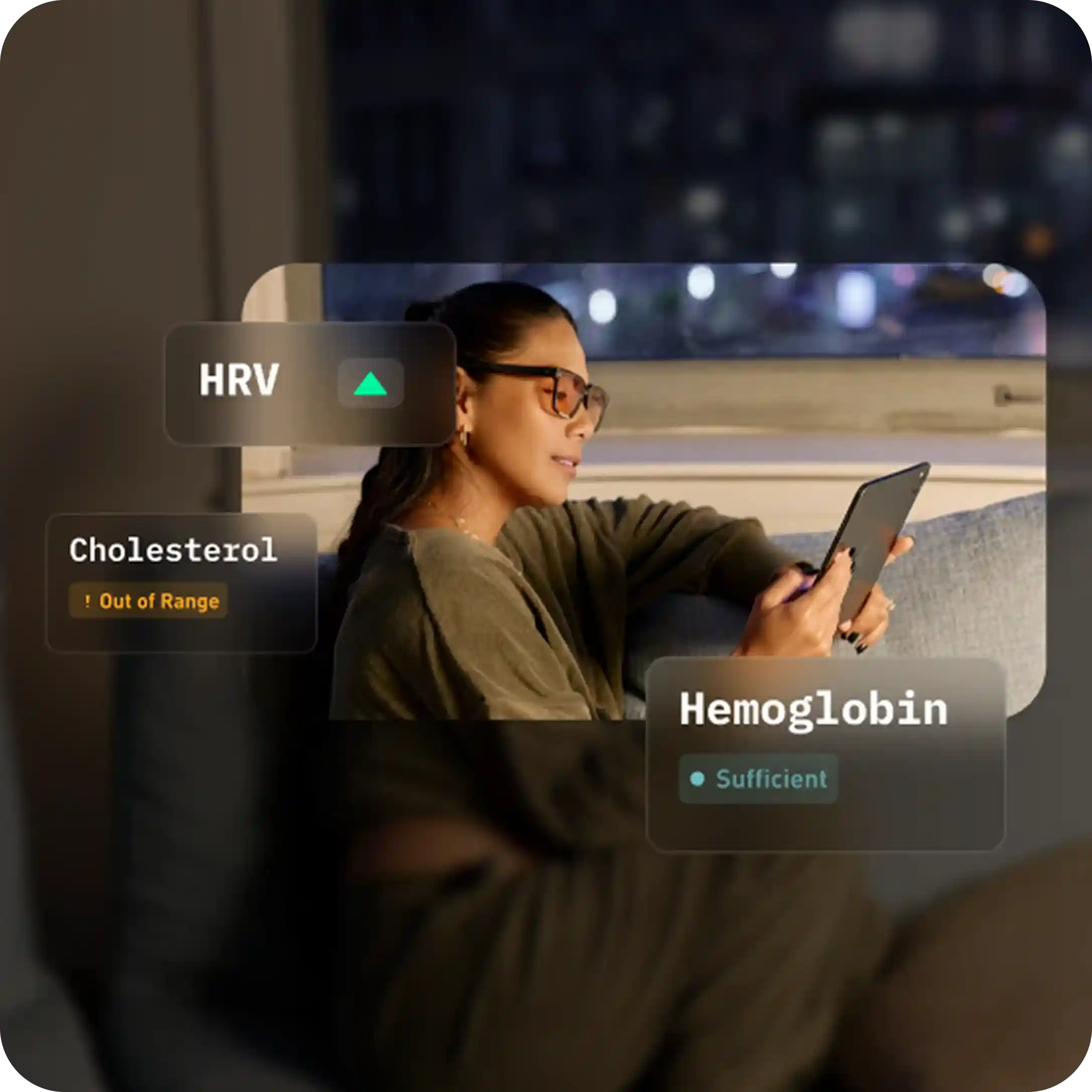 Person on a couch at night reviewing HRV, cholesterol out of range, and sufficient hemoglobin results in a health app.