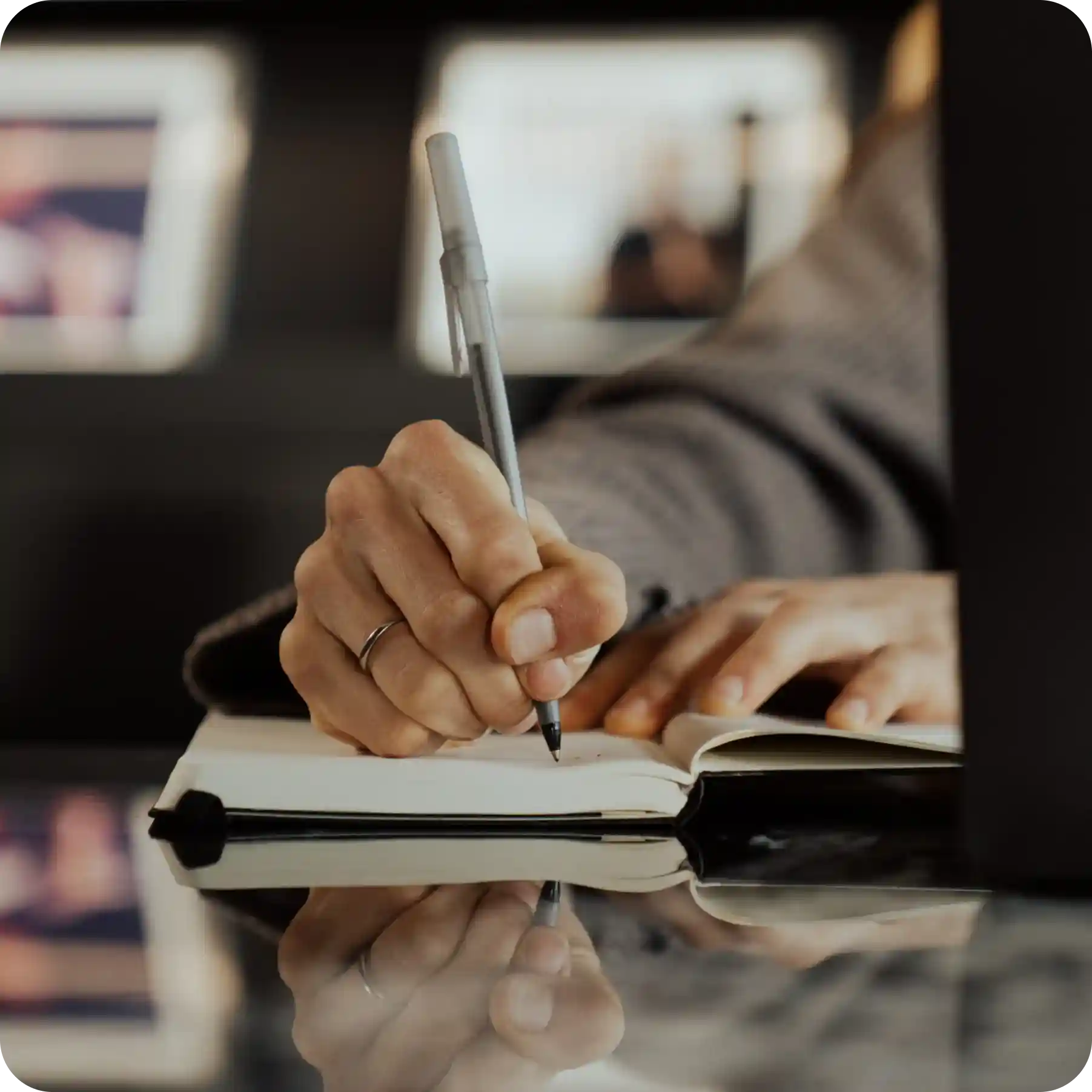 WHOOP team member taking notes during a product strategy session, reflecting research, innovation, and data-driven decision-making in wearable health technology.