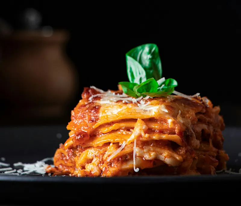 Lasagne is a layered dish made from pasta sheets, minced meat, tomato sauce and béchamel sauce
