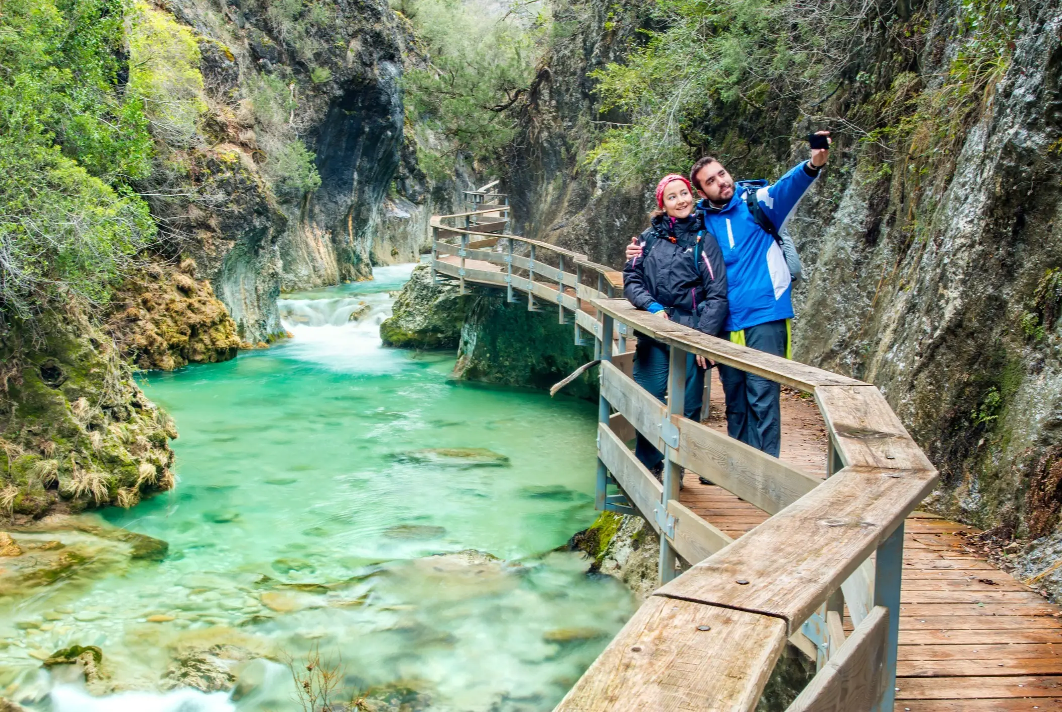 A couple on the bridge over the River Borosa in Cazorla, Andalusia, Spain.


