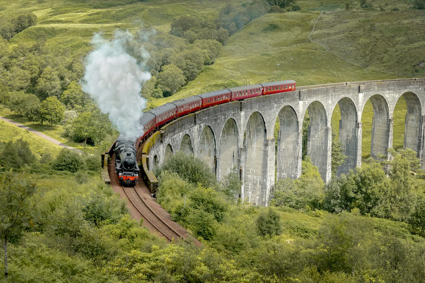 Historic Jacobin steam train crosses the Glenfinnan Viaduct. Glenfinnan, Highland, Scotland.