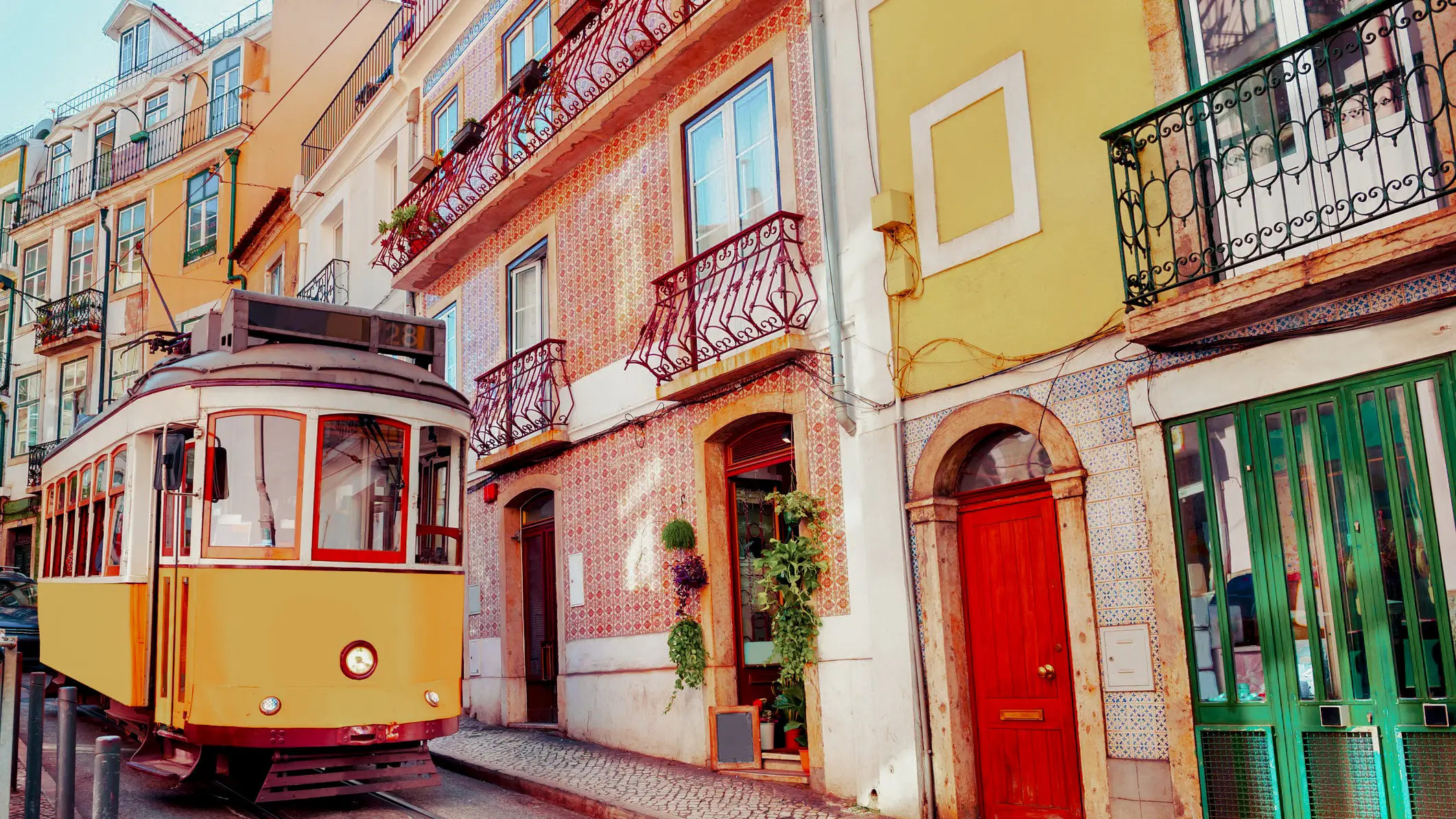 Portugal, Lisbon Vintage yellow streetcar on the street in Lisbon, Portugal