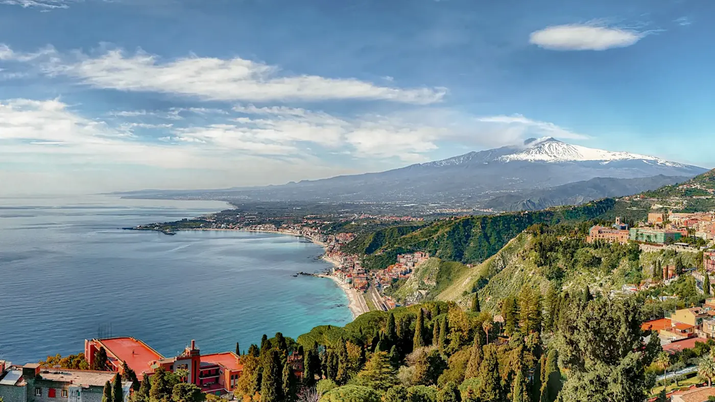 Coast with a view of Mount Etna and the sea. Taormina, Sicily, Italy.