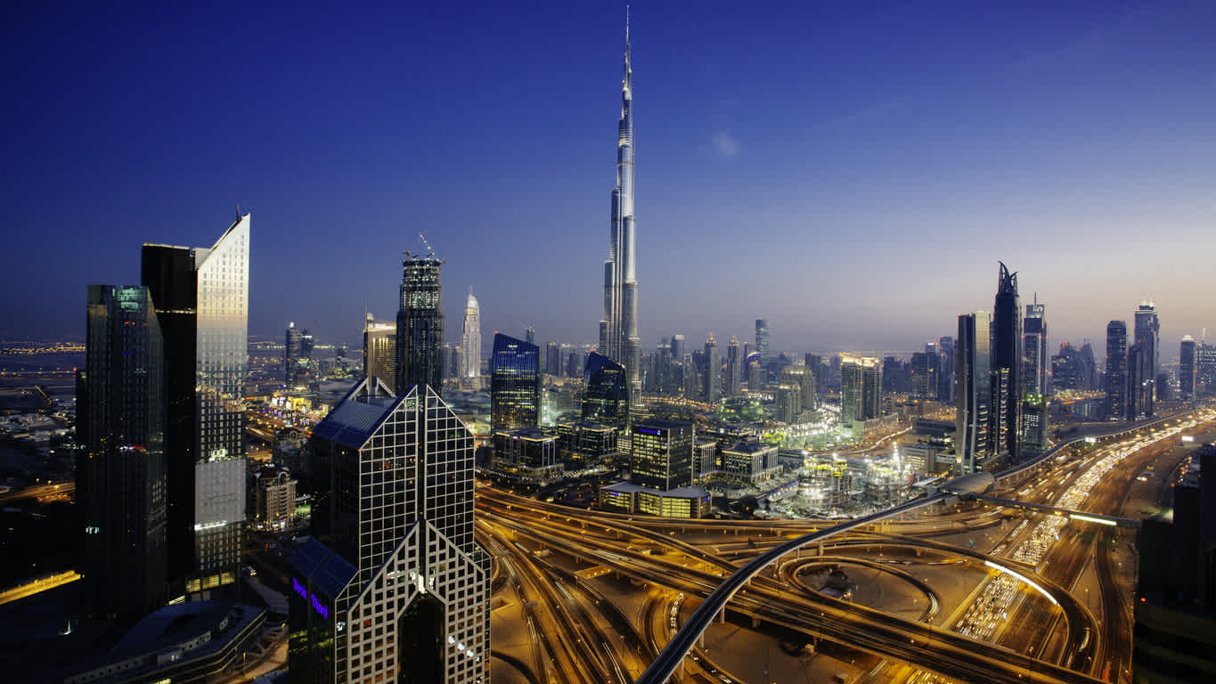 Admire the impressive skyscrapers that have transformed Dubai, here pictured at night, on a Dubai vacation 