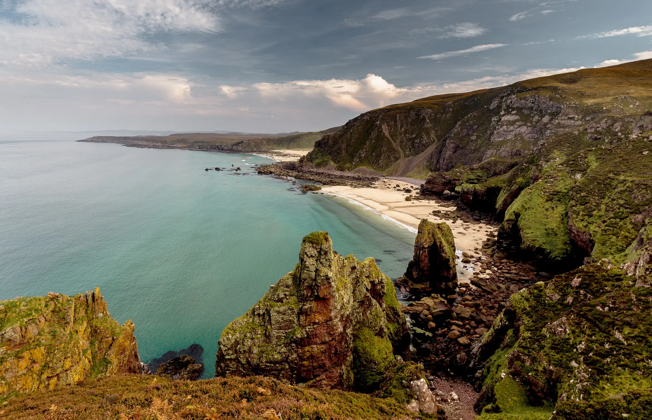 Scotland, Wester Ross Dramatic cliffs and white sandy beaches in Wester Ross, Scotland.