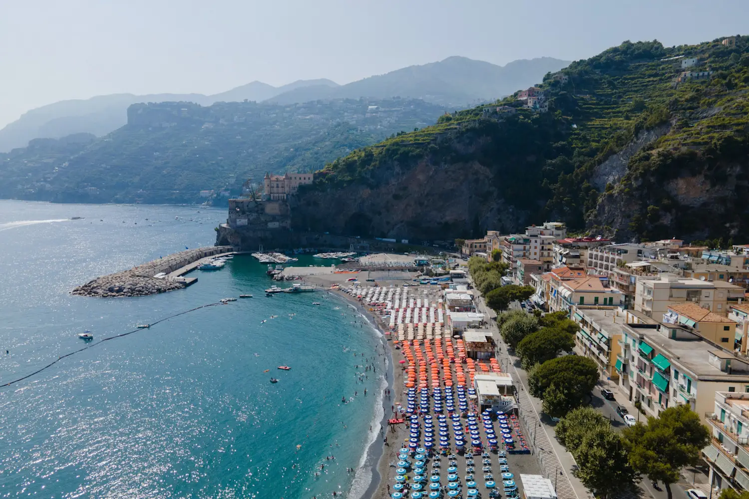 Aerial view of Maiori Beach with colorful umbrellas and a long beach