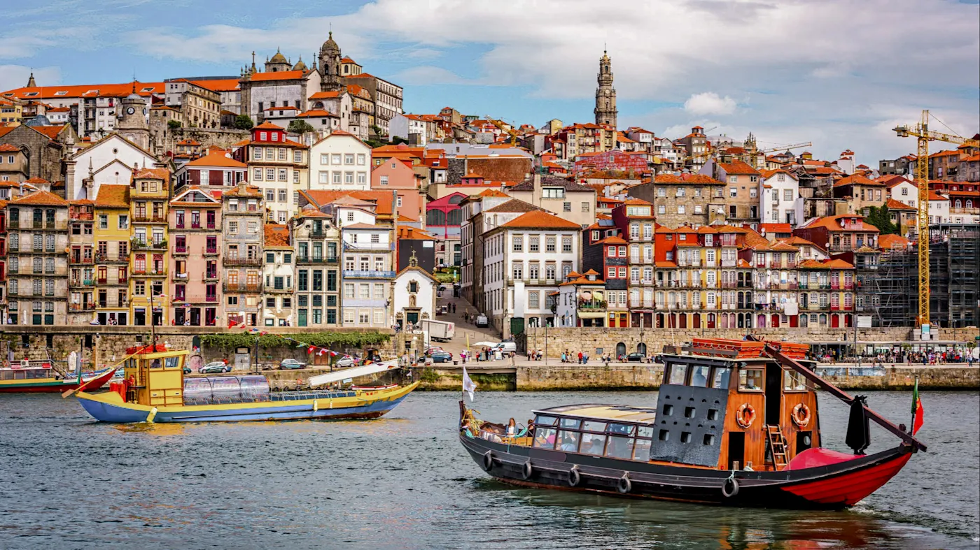 Portugal, Porto, Porto Colorful houses on the riverbank with city views. Porto, Porto, Portugal.