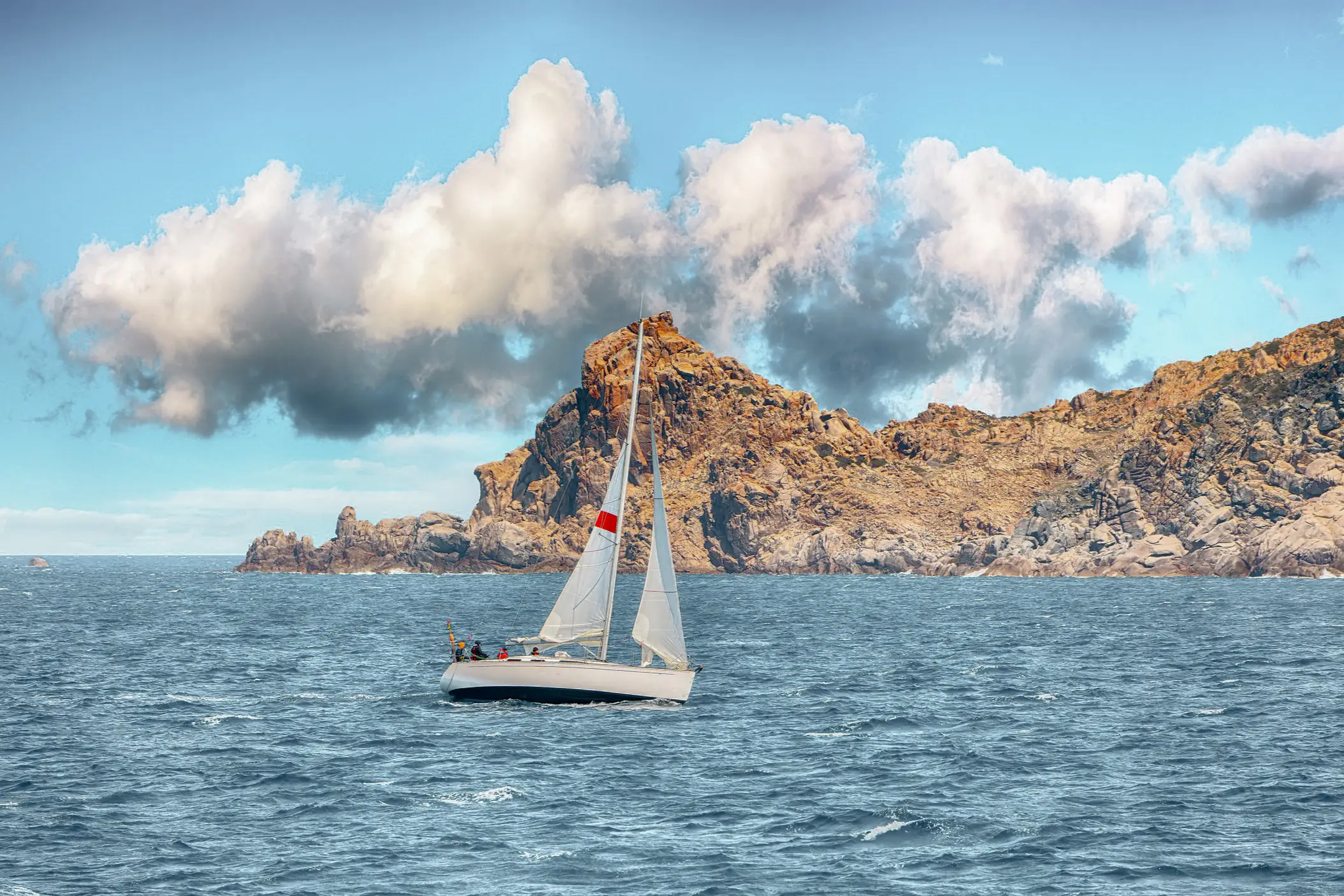 Italy, Sardinia, Santa Teresa Gallura The sailing boat near the cliffs of Santa Teresa Gallura, Sardinia, Italy.