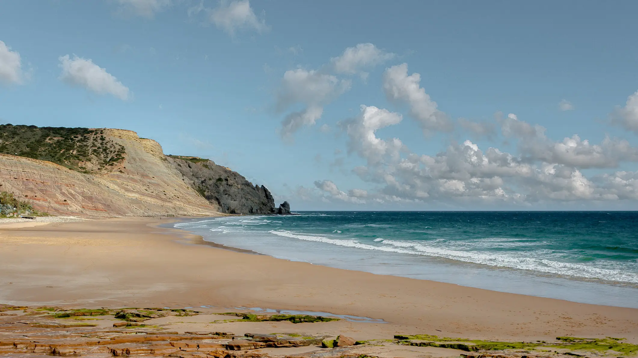 Portugal, Algarve, Praia da Luz Beach and rocky coast of Praia da Luz in the Algarve in Portugal