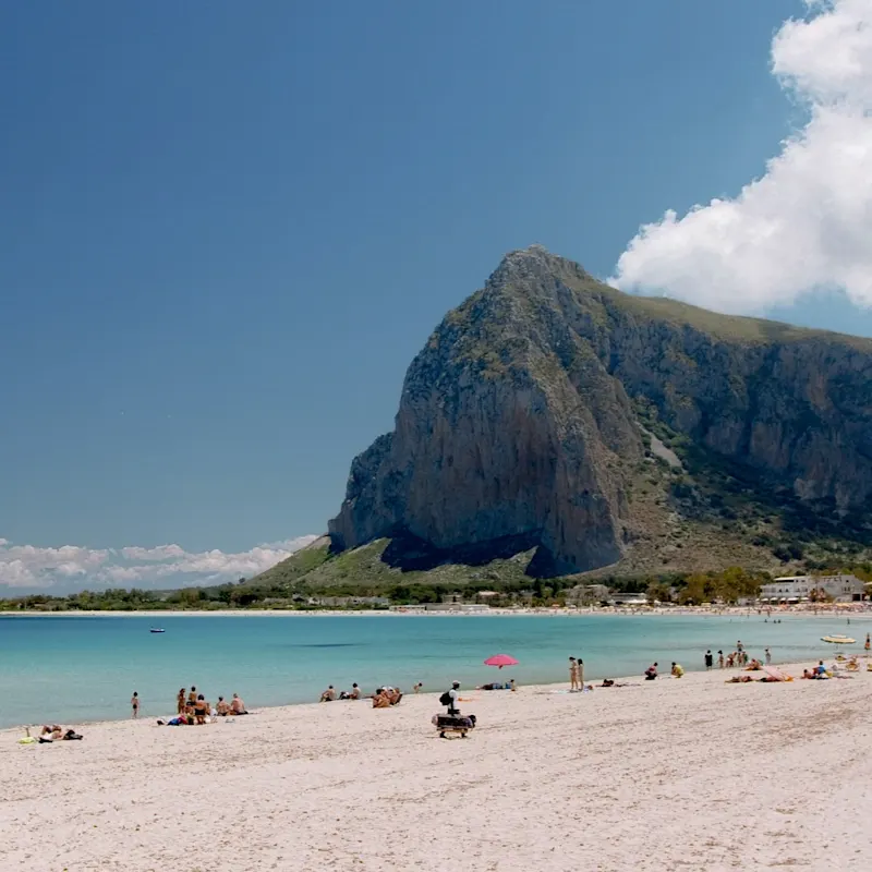 San Vito Lo Capo in Sicily boasts a beautiful beach surrounded by steep, green hills and crystal-clear water