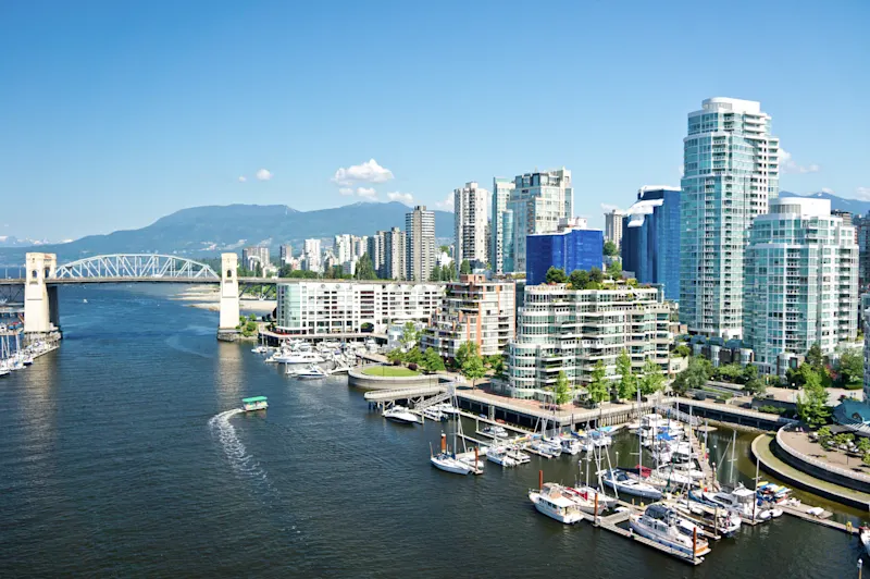 A view of downtown Vancouver and Snow Mountain on the other side of the strait.