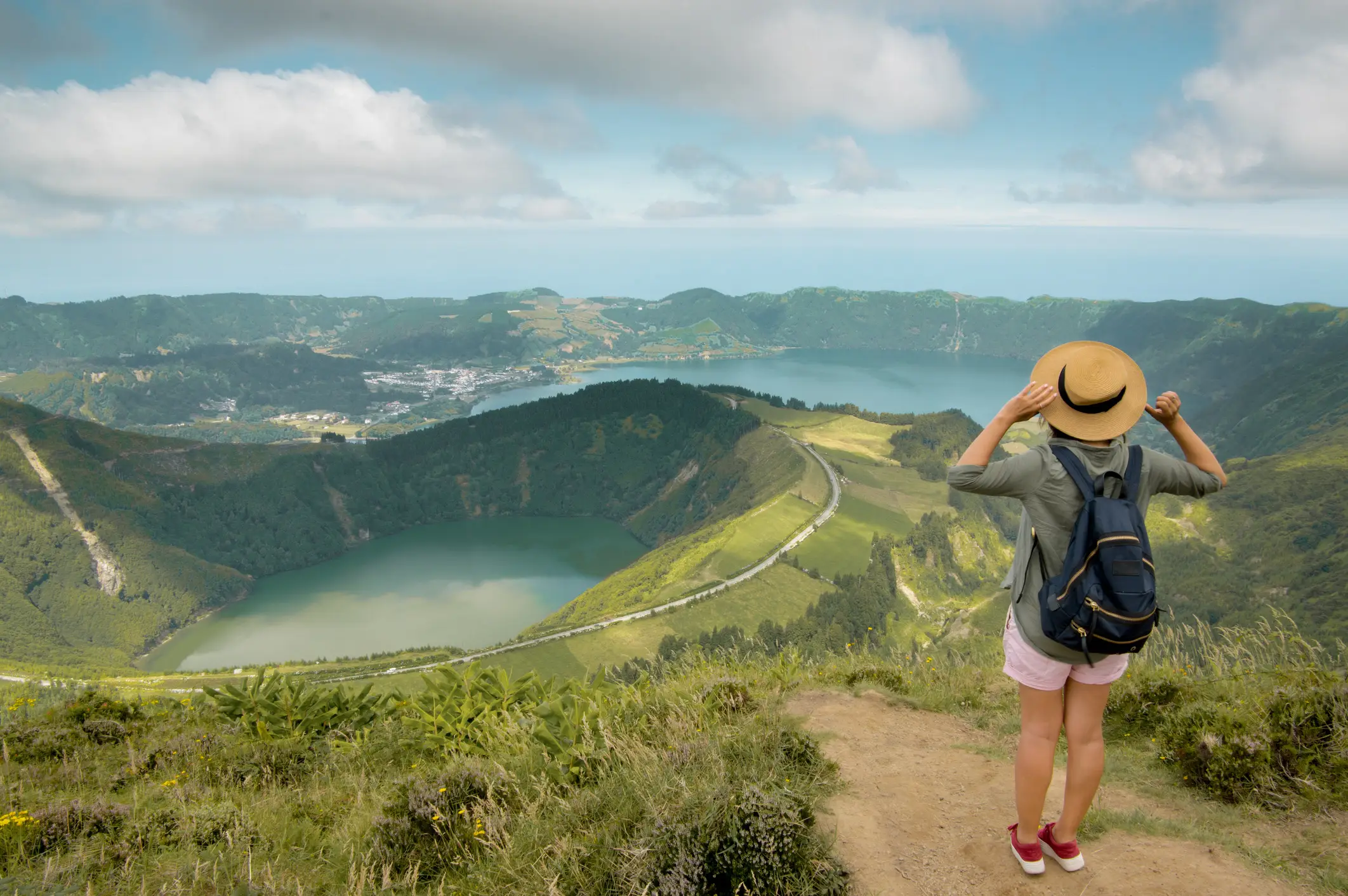 A girl in front of the volcanic crater on the island of Sao Miguel, Azores, Portugal

