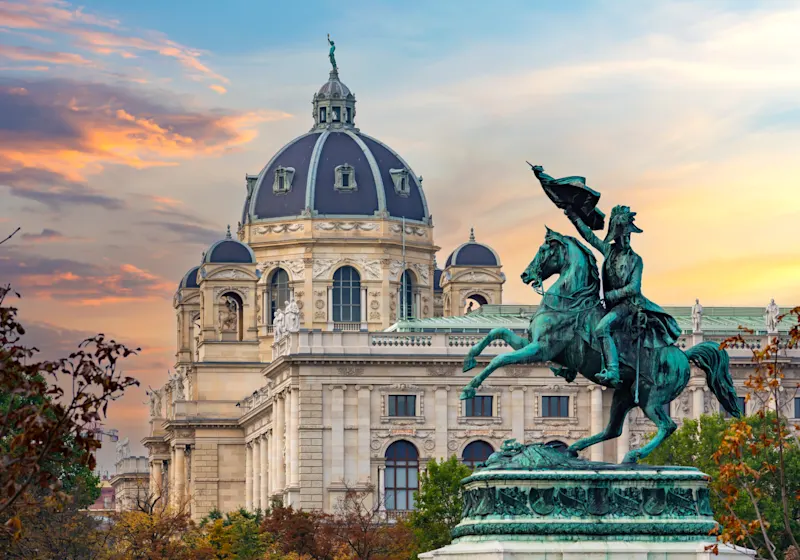 Austria, Vienna, Building with Statue A statue in front of a building in Vienna, Austria.