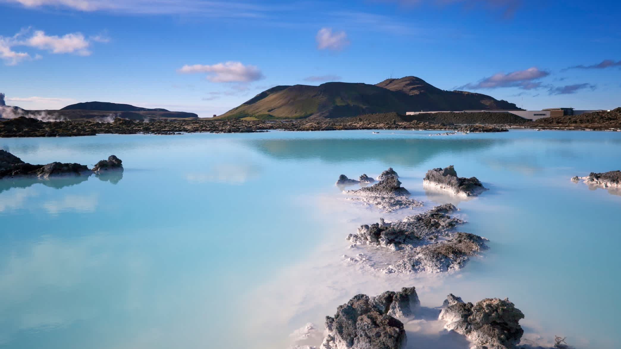 Enjoy the beautiful blue waters of the Blue Lagoon thermal spa in Iceland on an Iceland vacation package