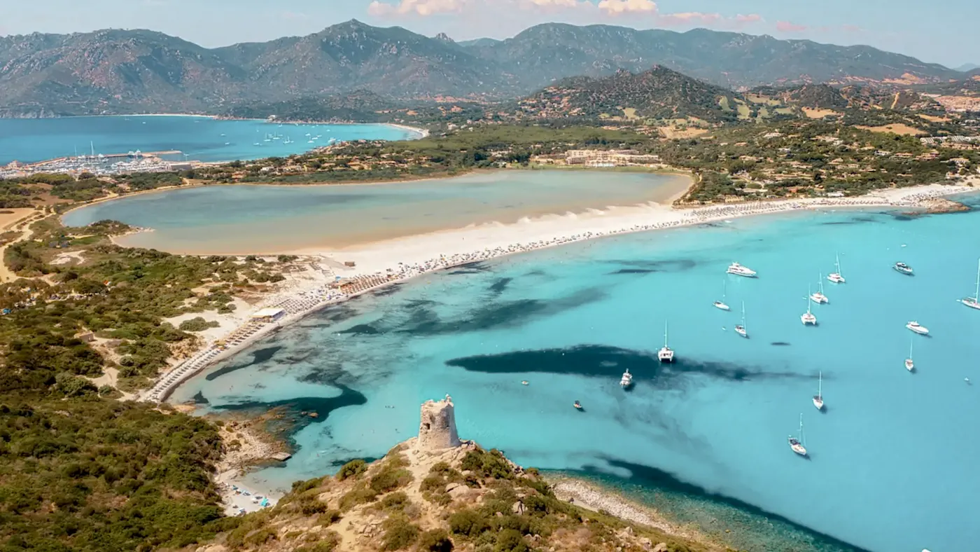 Italy, Sardinia, Villasimius Beaches with turquoise sea and tower. Villasimius, Sardinia, Italy.