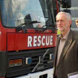 Photo of Jeremy Corbyn stood next to a fire engine with 'Rescue' on the front