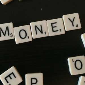 The word 'Money' spelled out in scrabble.