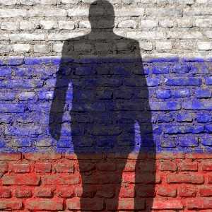 Silhouette of businessman against the Russian flag 