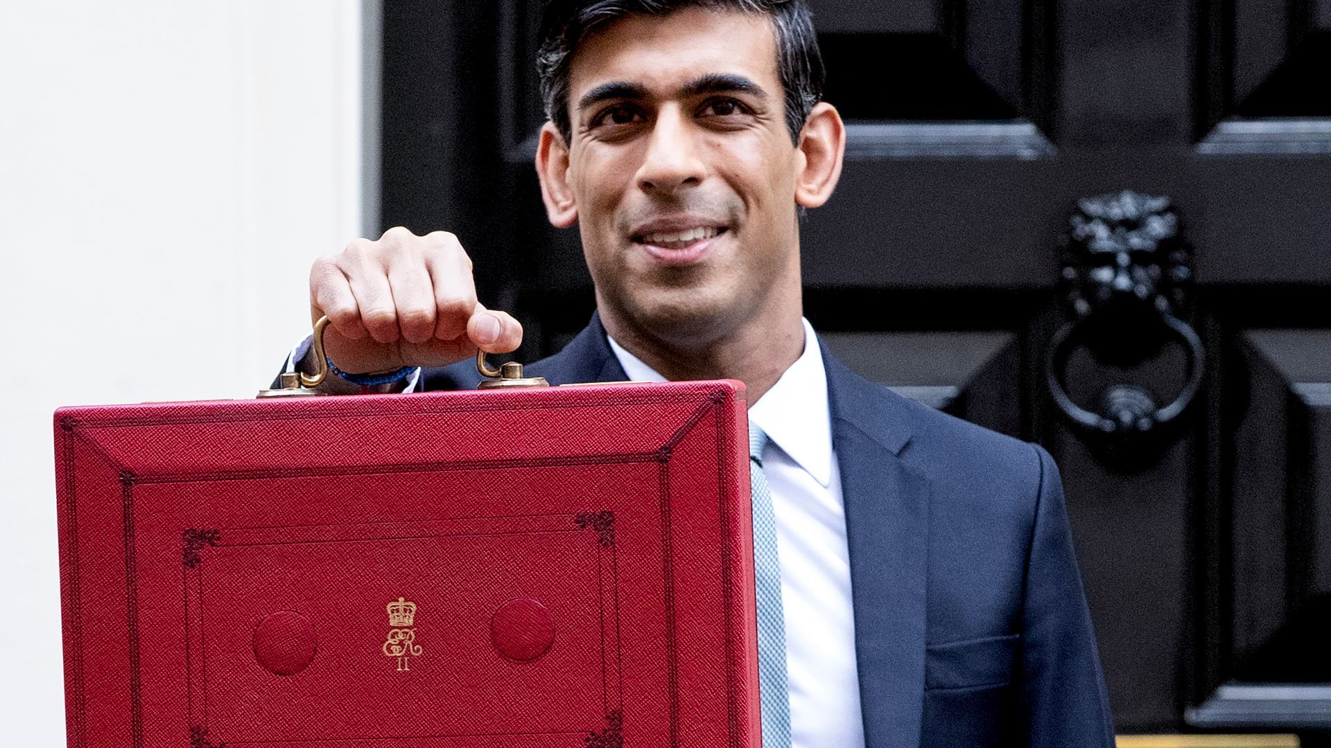 The Chancellor with the Budget box in front of 11 Downing Street before heading to the House of Commons to deliver the Budget, 11 March 2020 (© HM Treasury)