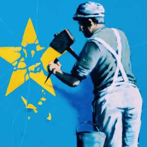 Banksy Brexit mural showing a man chiselling a star from the EU flag