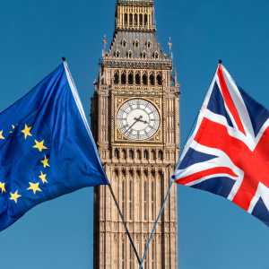 EU and UK flags in front of Big Ben, Houses of Parliament, Westminster