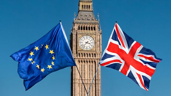 EU and UK flags in front of Big Ben, Houses of Parliament, Westminster