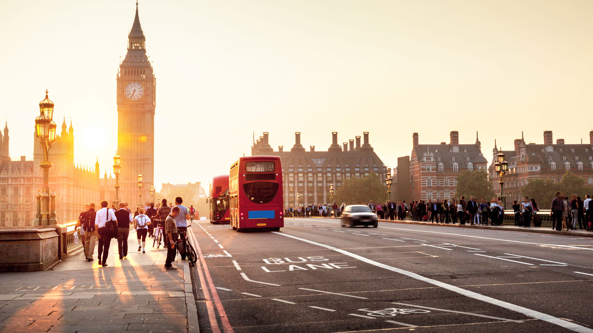 People walking over Westminster Bridge towards the Palace of Westminster, Houses of Parliament