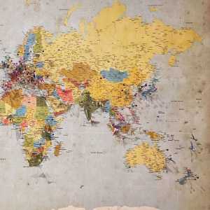Map of the world covered in map pins