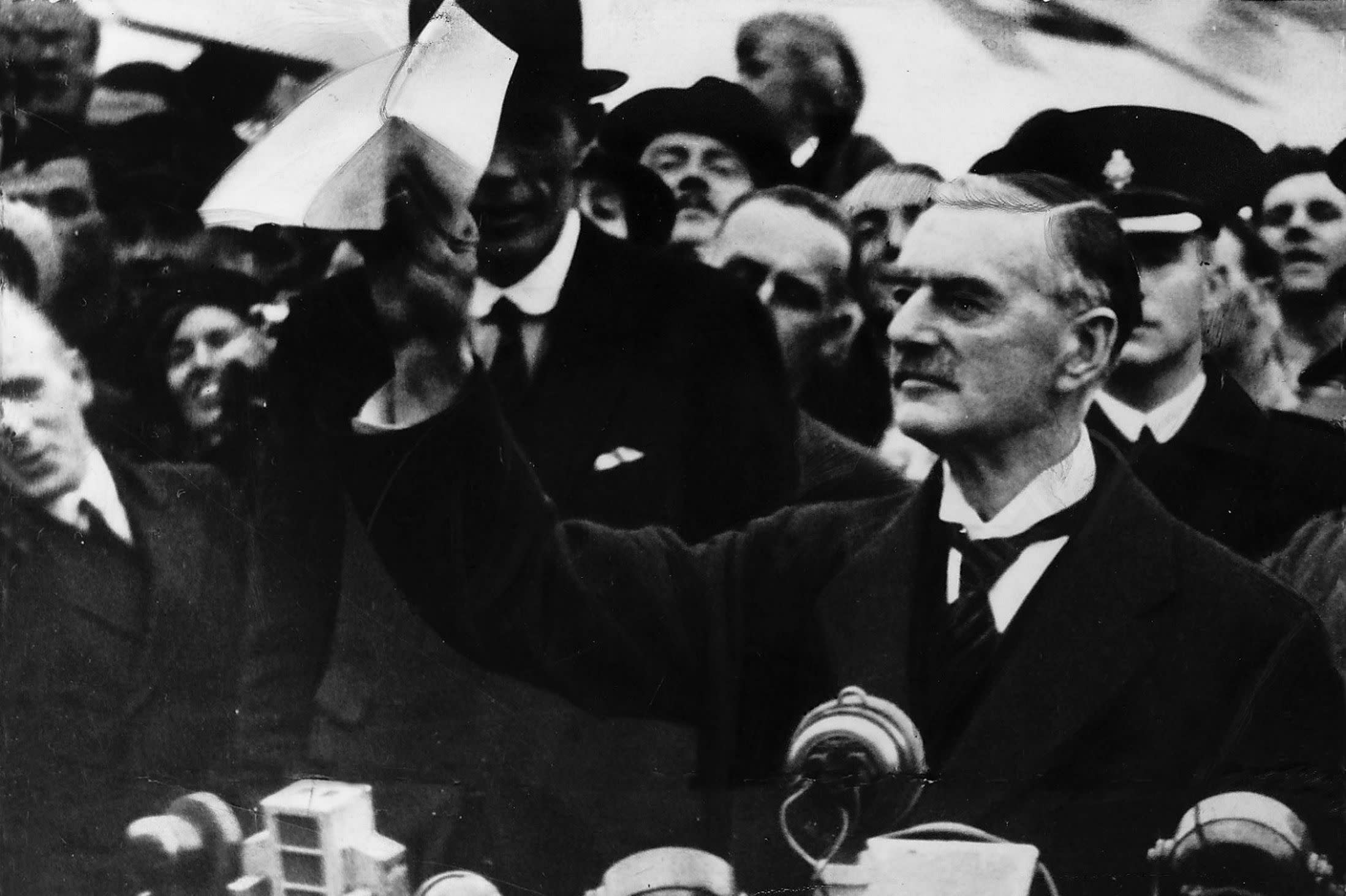 Neville Chamberline waving a copy of the Munich Agreement