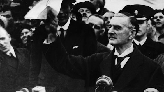 Neville Chamberline waving a copy of the Munich Agreement