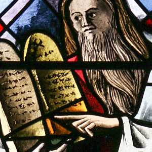 Stained glass showing Moses holding the Tablets of Stone