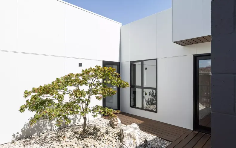 A modern home featuring minimalist design which connects the indoor and outdoor seamlessly.