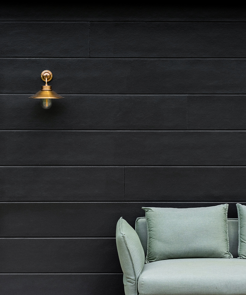 Stria Cladding painted black.